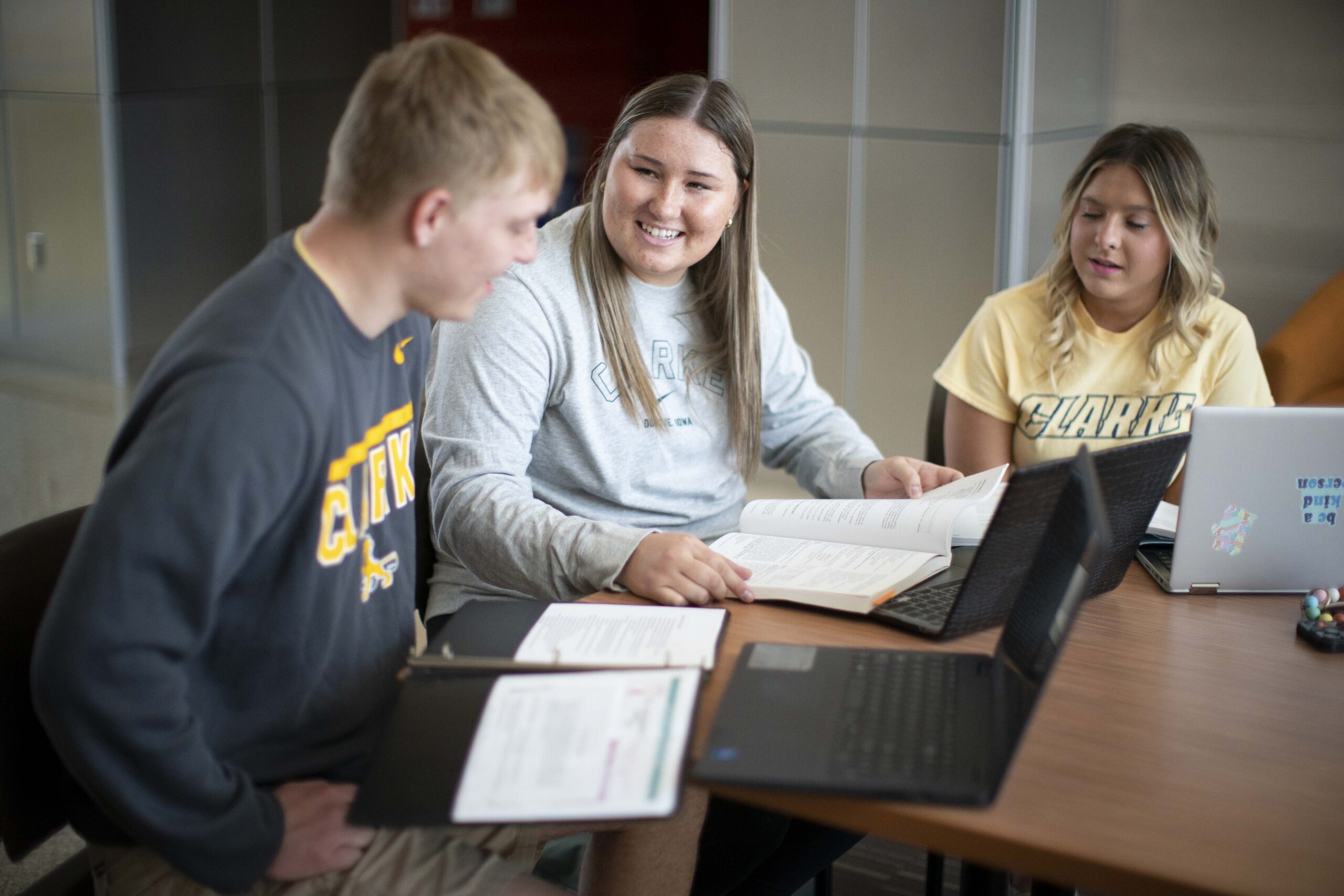 Students engaging with their professor at Clarke University.
