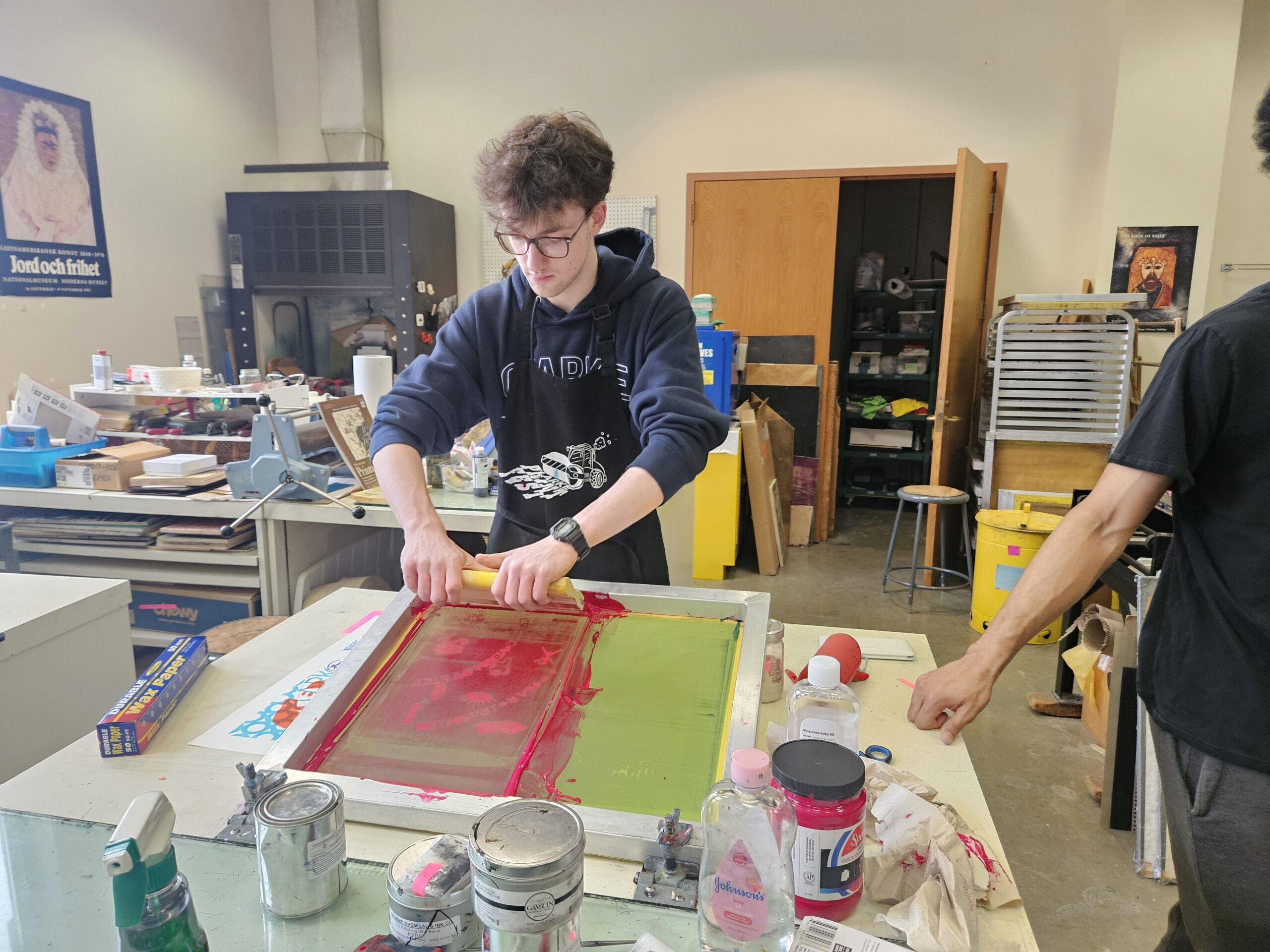 Clarke University Art Education student learning hands on techniques.