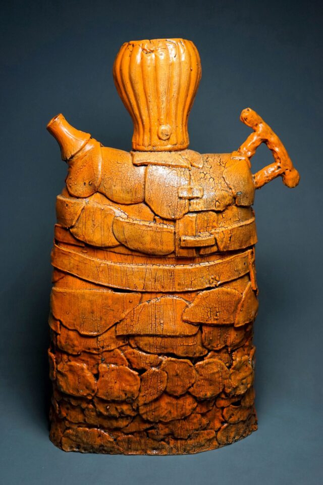 Orange ceramic sculpture by Troy Aiken.