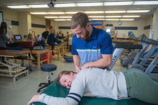 A Clarke University Athletic Training Student learning in the classroom