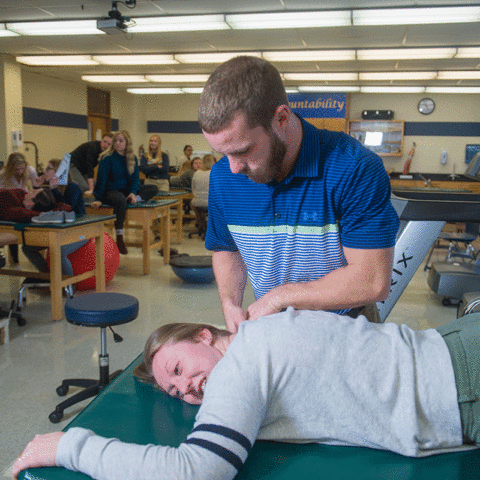 A Clarke University Athletic Training Student learning in the classroom