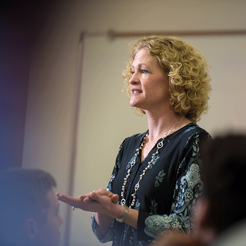 Clarke University business administration professor in class