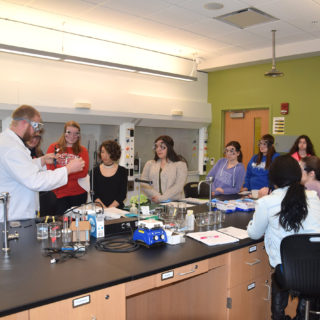 Chemistry Major students in class gaining instruction from professor