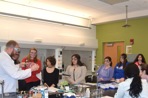 Chemistry Major students in class gaining instruction from professor