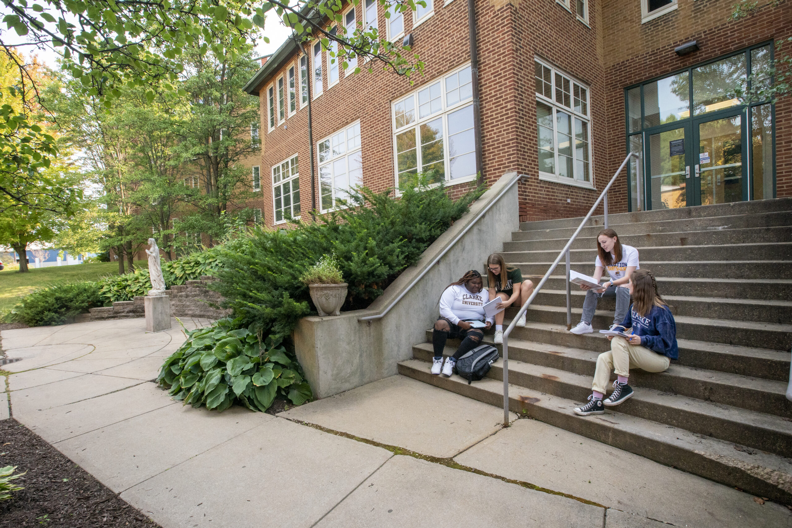 Clarke University students working together in class.