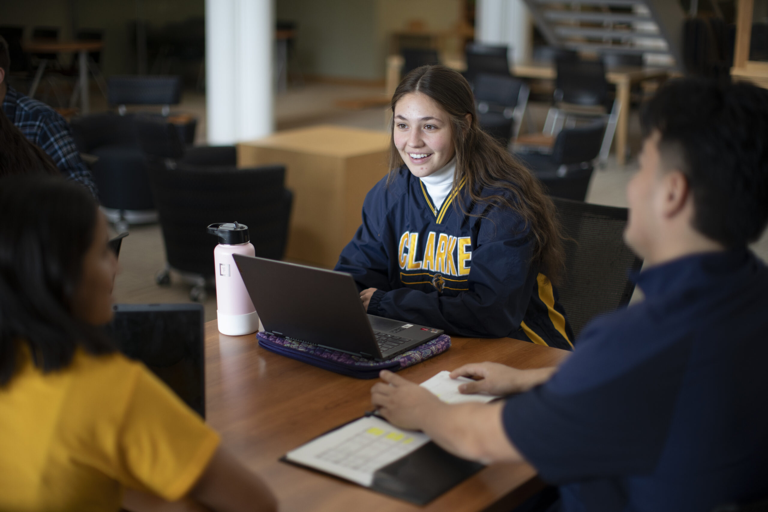 Clarke University students collaborating on a project.