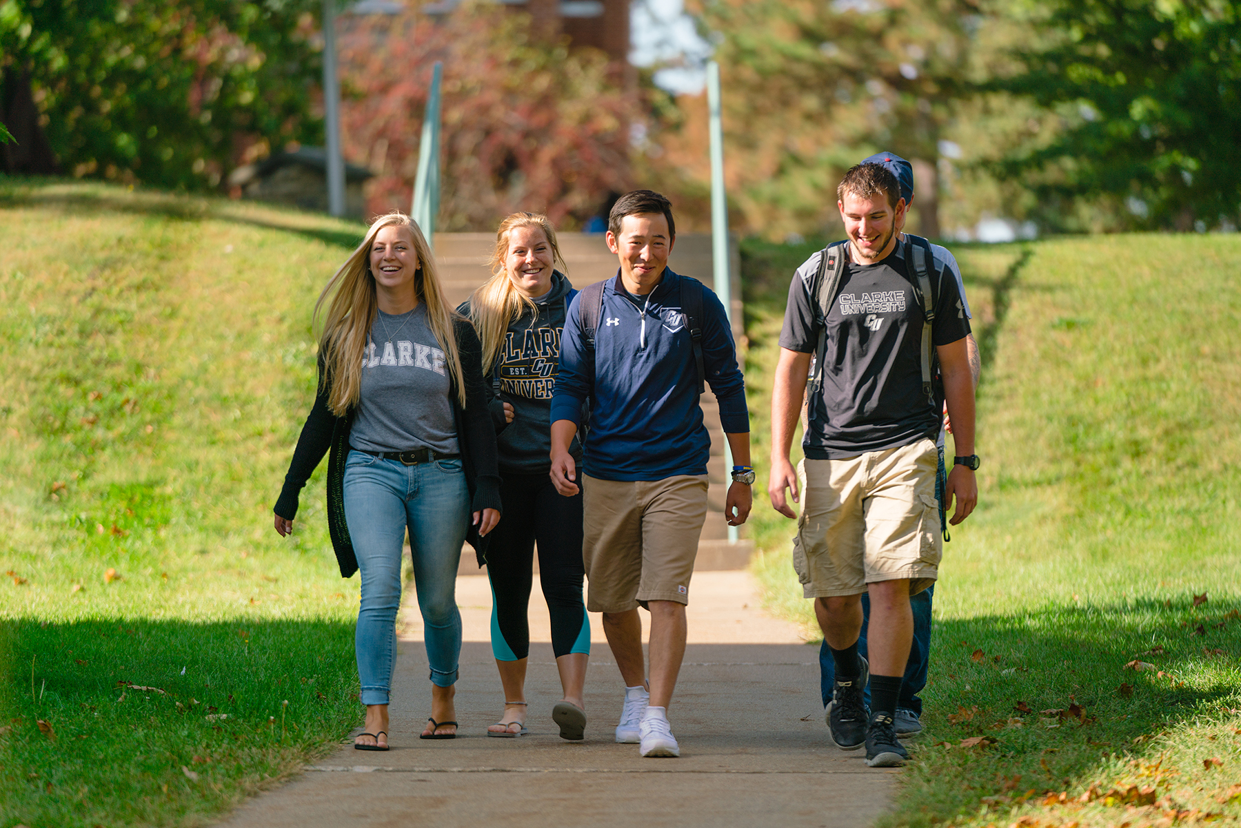 Clarke University transfer students walking between class.