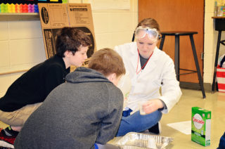 Clarke Education Major working with elementary students in lab