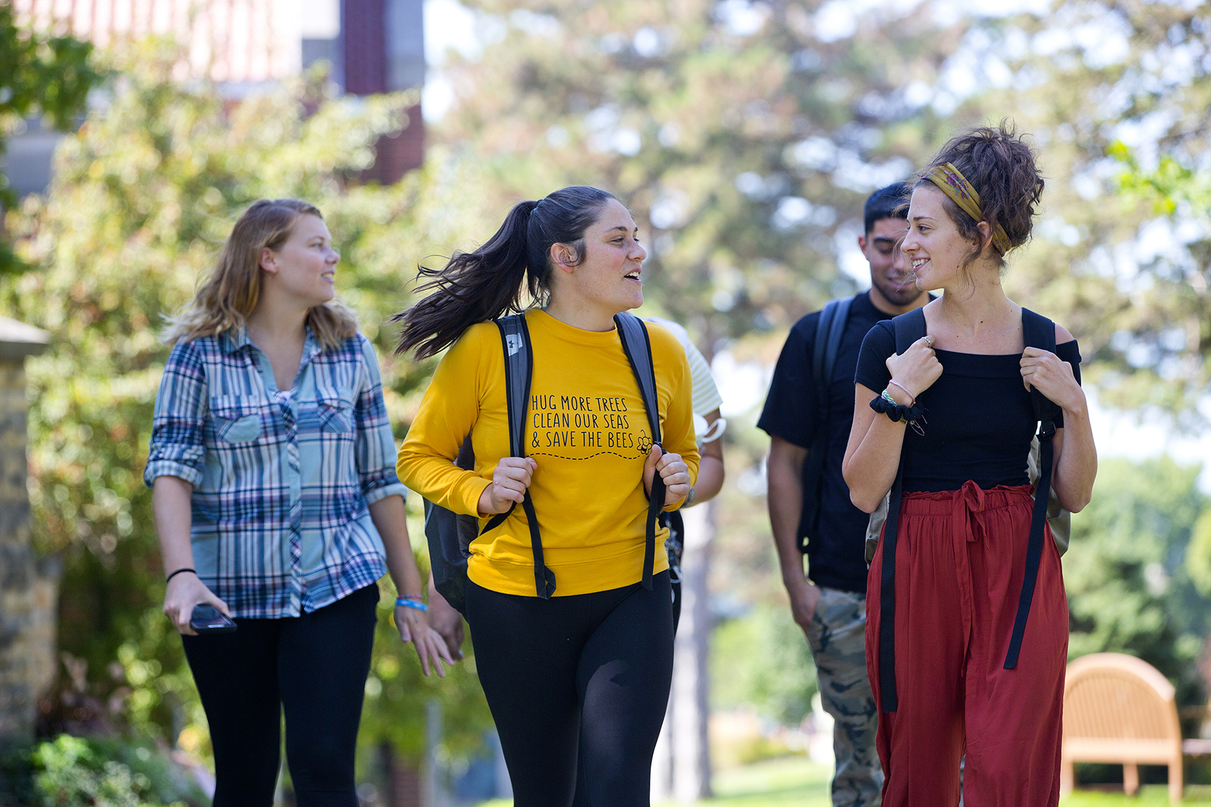 Clarke University major students walking on campus.