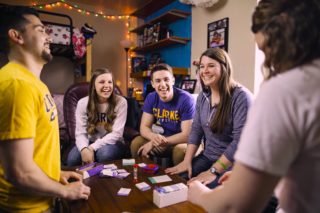 Emily and students in dorm room