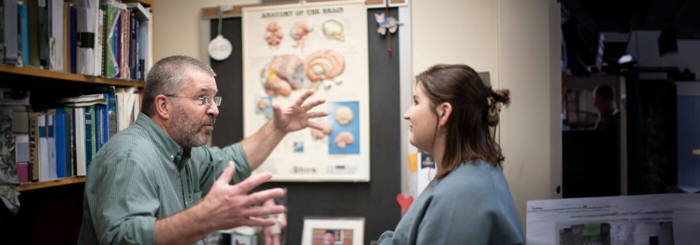 Tim B discussing with a Clarke University psychology student.