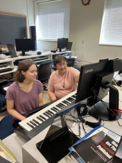 Amy Dunker assisting high school student with Rise Up Strong!