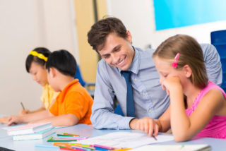 Clarke University Education Major working with students in the classroom