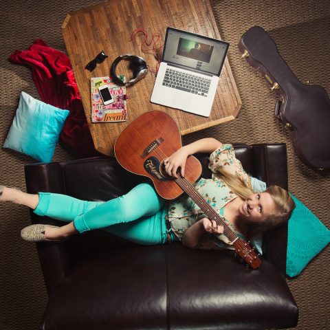 Overhead photo of Clarke Music Degree Student with a guitar