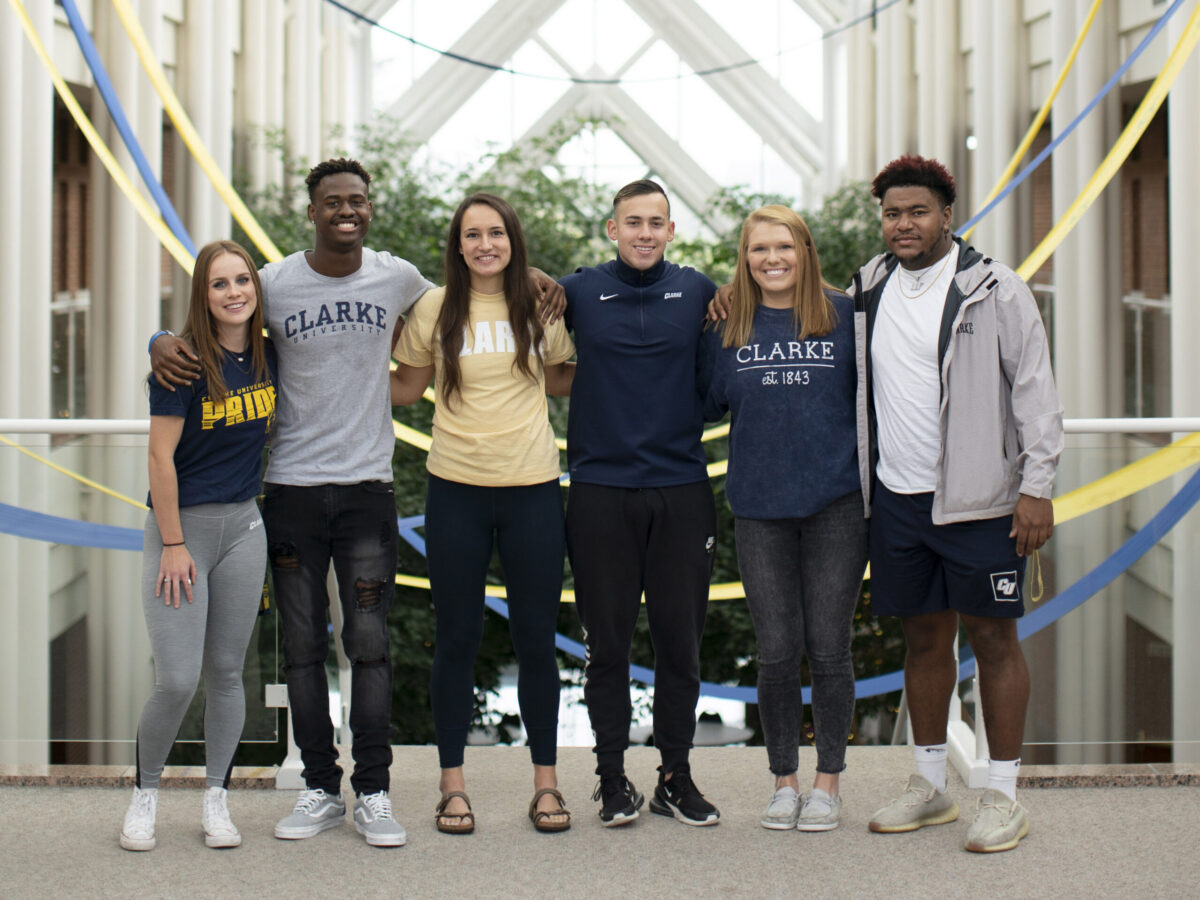 clarke students in atrium building