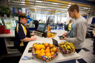 Clarke student purchasing a meal at the crusader cafe