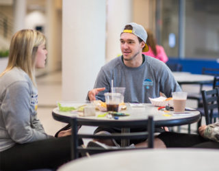 Students enjoying a meal at the Crusader cafe