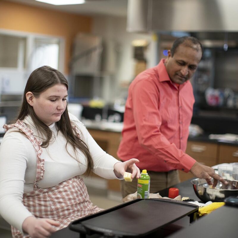 student and faculty working in food science lab