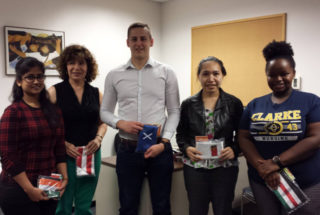 Some of Clarke's international students holding their country's flags