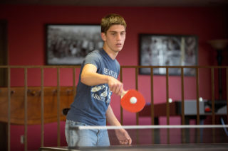 Clarke student playing ping-pong