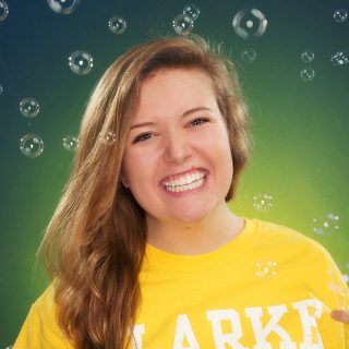 Student with bubbles in background