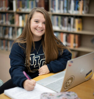 student working on computer