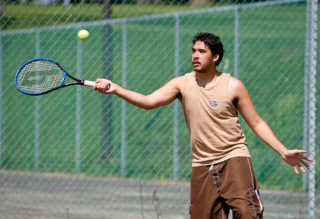 Clarke student playing tennis